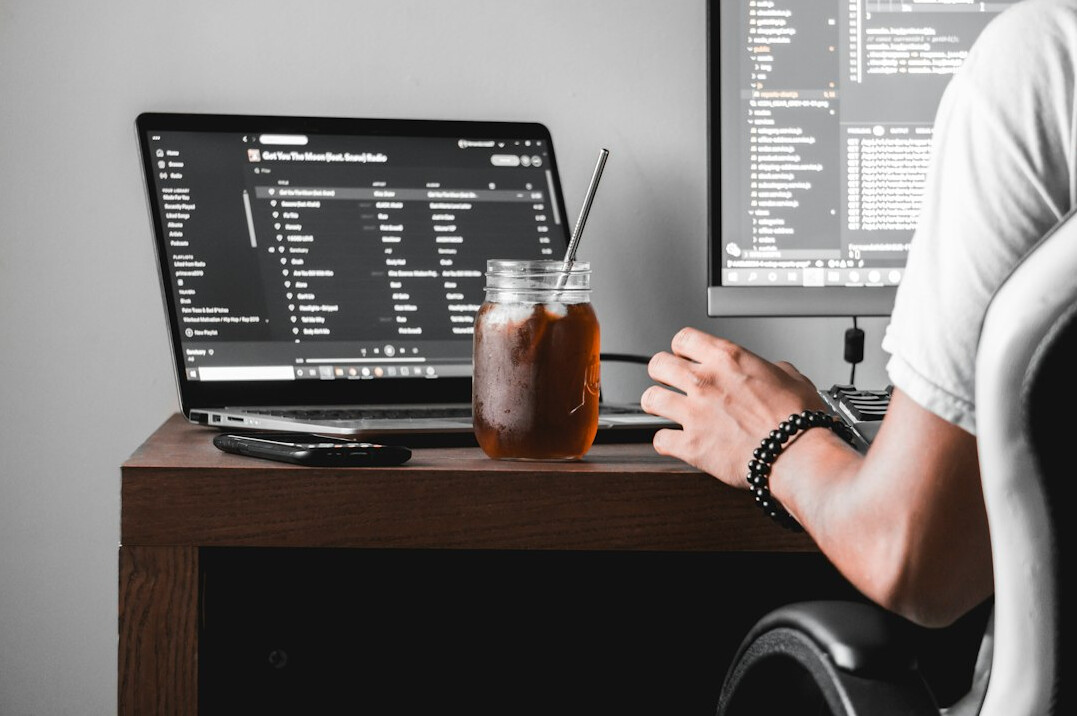 person learning coding at desk
