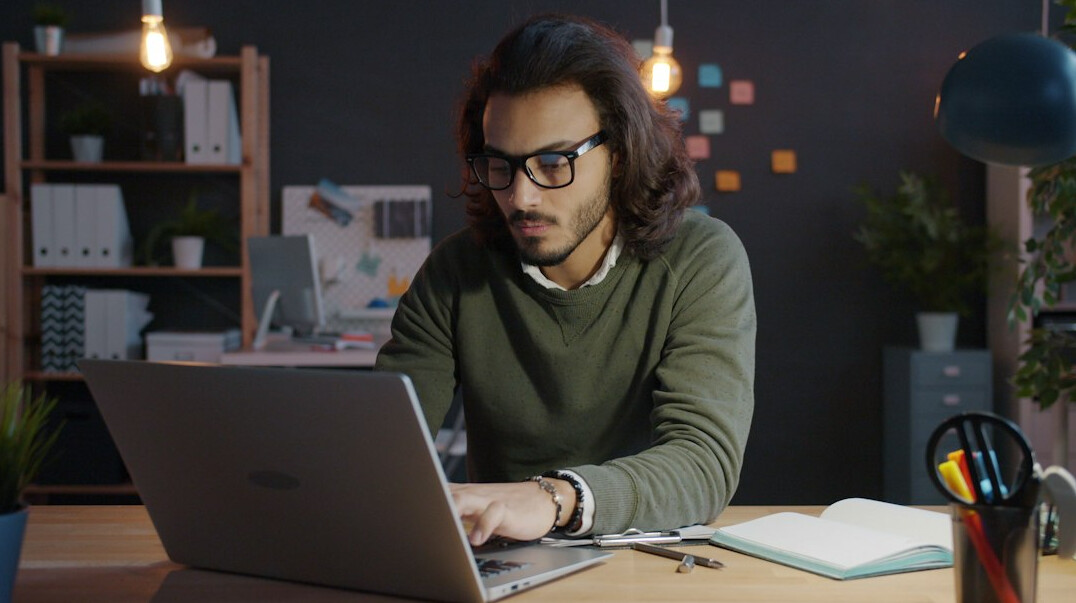 programmer working on laptop