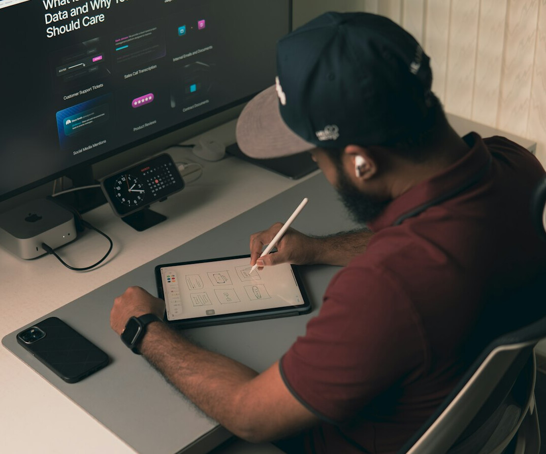 student writing code at desk